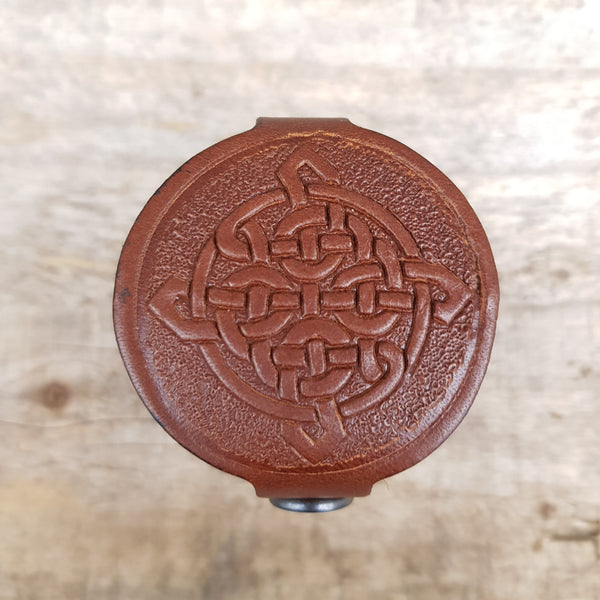 Brown celtic knot top of leather case