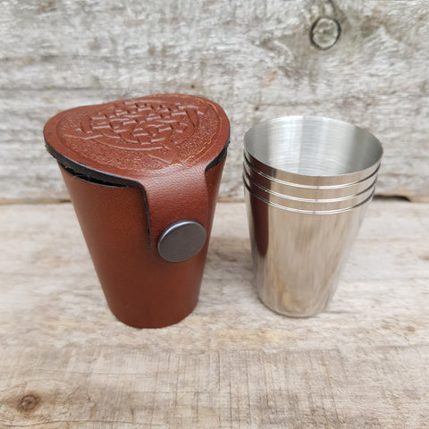 Brown leather case embossed with celtic knot. 4 dram glasses