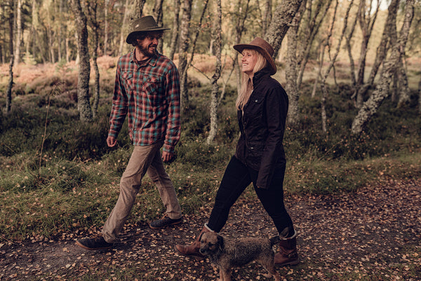 Male and female models walking wearing leather bush hats