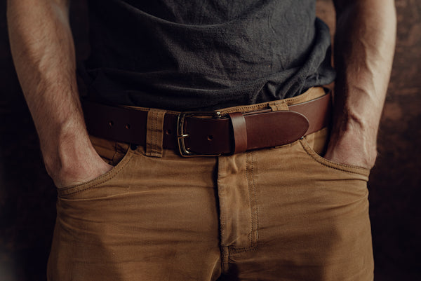 Male model wearing a wide brown handmade leather belt
