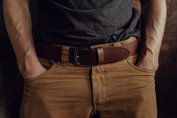 Male model wearing a wide brown handmade leather belt
