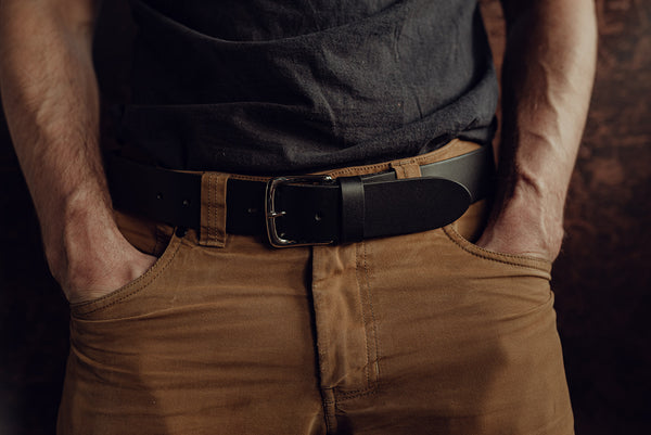 Male model wearing a wide black leather belt